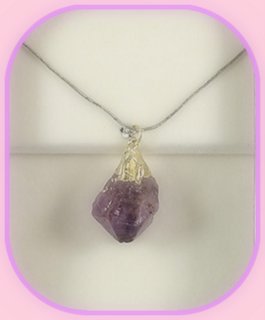 Rough Amethyst Point Pendant approximately 3 x 2 cm; Length of the chain is 60 cm.